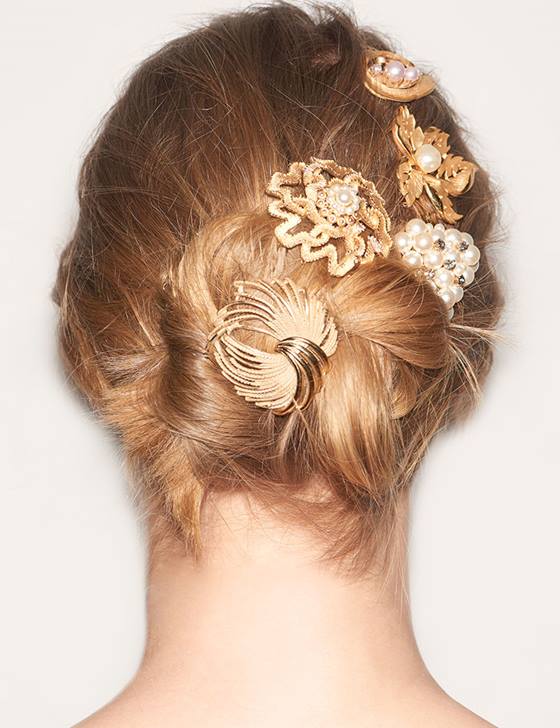 Blonde updo with hair accessories