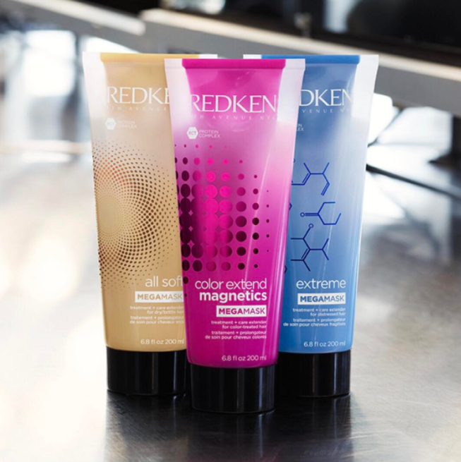 Redken All Soft Mega Mask, Color Extend Magnetics Mega Mask and Extreme Mega Mask next to each other on counter.